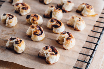 Puff pastry heart cookies on a baking paper