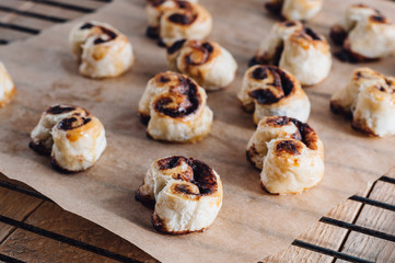 Puff pastry heart cookies on a baking paper
