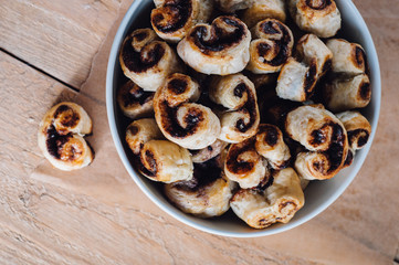 Puff pastry heart cookies on a baking paper