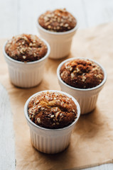Homemade banana peanut muffins in ceramic baking form