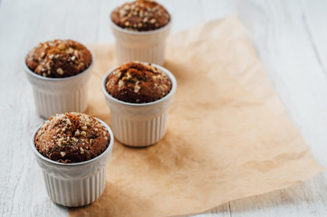 Homemade banana peanut muffins in ceramic baking form