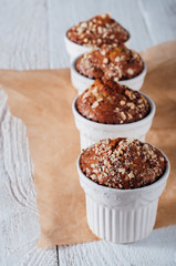 Homemade banana peanut muffins in ceramic baking form