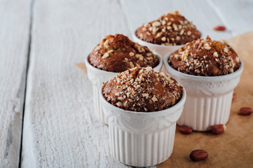 Homemade banana peanut muffins in ceramic baking form