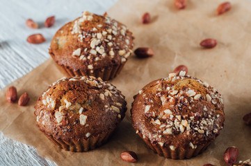 Homemade banana peanut muffins on baking paper