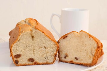 Sweet cake with raisins and cup of tea 