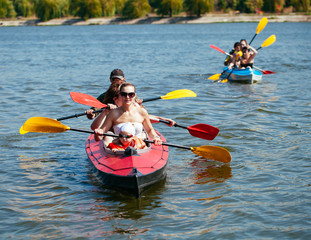 People of all ages in a kayak. Family holiday.