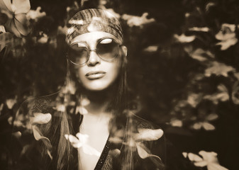 Double Exposure Portrait of a Beautiful Hippie Girl and Flowers