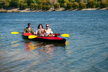 People of all ages in a kayak. Family holiday.