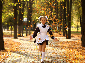 Happy little schoolgirl go home from school - obrazy, fototapety, plakaty