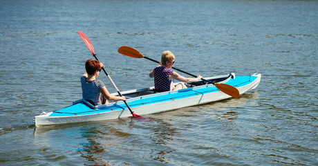 Fototapeta premium Young people in canoes. Family holiday.