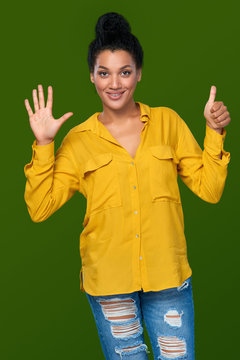 Woman showing six fingers