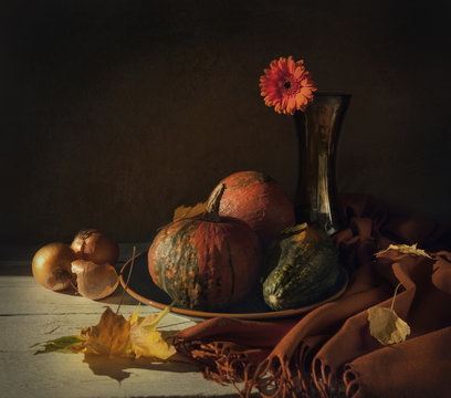 Still life with pumpkins and flower