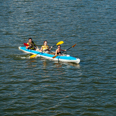 Young people in canoes. Family holiday.