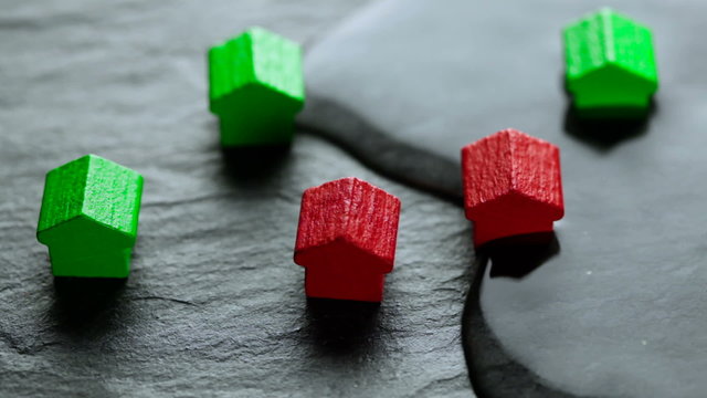 Flooded toy houses - concept of real estate, flood and flood damage