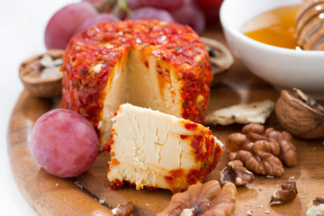 soft cheese and snacks on a board