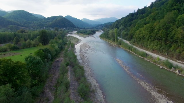 Aerial: flight above mountain river