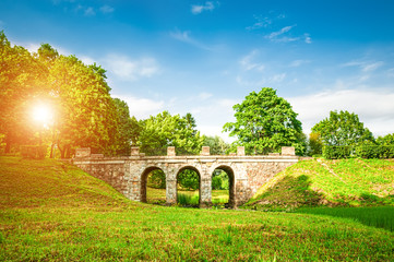 Ancient bridge in summer park