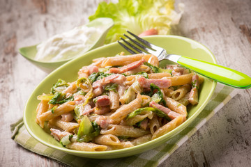 pasta with bacon lettuce and cream sauce, selective focus