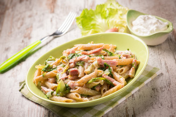pasta with bacon lettuce and cream sauce, selective focus
