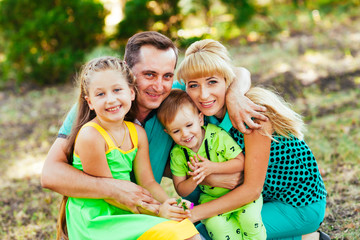 Fototapeta premium Happy family in the park. Happiness.