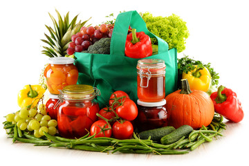 Composition with shopping bag and organic food over white