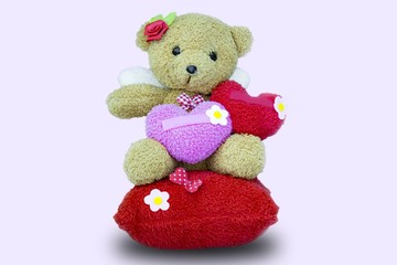 Toy teddy bear  with heart valentine concept on white background