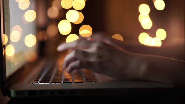Female hands typing on a laptop keyboard for Christmas