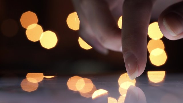 Closeup Finger Touching Tablet Computer Touchscreen on christmas 2