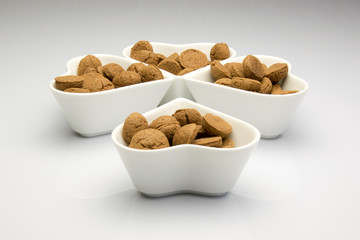 Four dishes formed as a clover four filled with kruidnoten