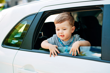Adorable baby boy in the car