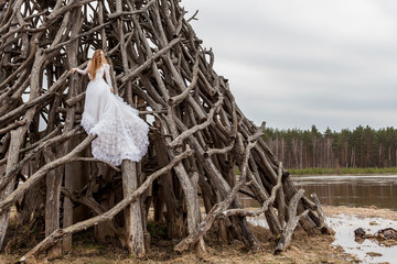 Vintage bride standing on wooden tower. Women in Fairytale