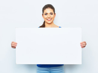 young woman holding white blank signboard.