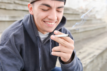 problem of adolescence.Sad and thinker teenager smoking cigarett