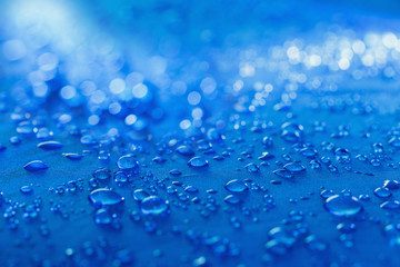 Rain Water droplets on blue fiber