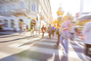 colorful people on busy street in motion,