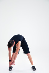 Obraz na płótnie Canvas Athletic man doing warm up exercises