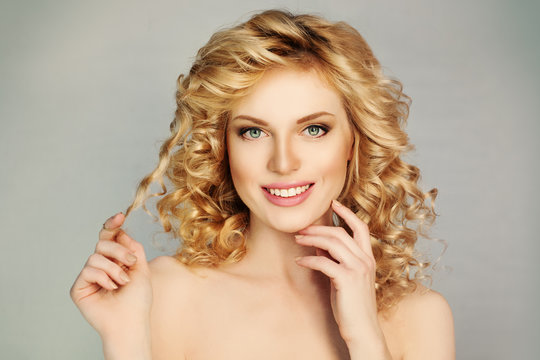 Pretty Girl with Curly Hair and Toothy Smile. White Teeth, Blond