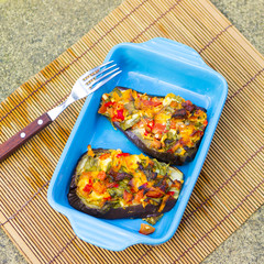 Baked aubergines with vegetables and cheese