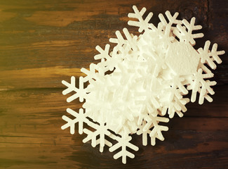 Wooden background with snowflakes