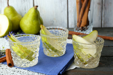Pear juice with fresh fruits on table close up