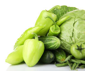 Heap of green vegetables isolated on white