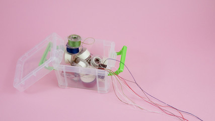 Thread spools in mini plastic box container. (1)