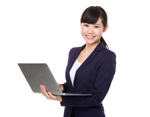 Asian Young businesswoman use of the notebook computer