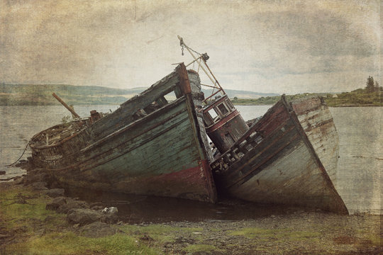 Fototapeta Old boads aground in Isle of Mull