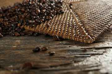 roasted coffee scattered on wooden background