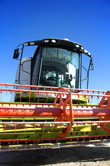 Harvester against the blue sky