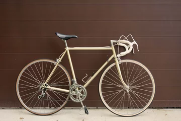 vintage bicycle leaning against the wall