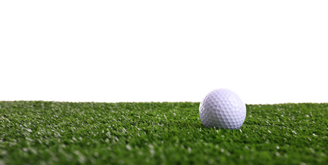 Golf ball on grass isolated on white