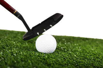 Golf set on grass isolated on white