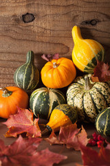 decorative pumpkins and autumn leaves for halloween